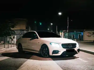 white mercedes benz coupe on road during night time