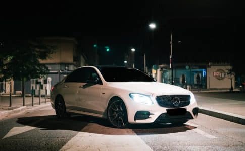 white mercedes benz coupe on road during night time